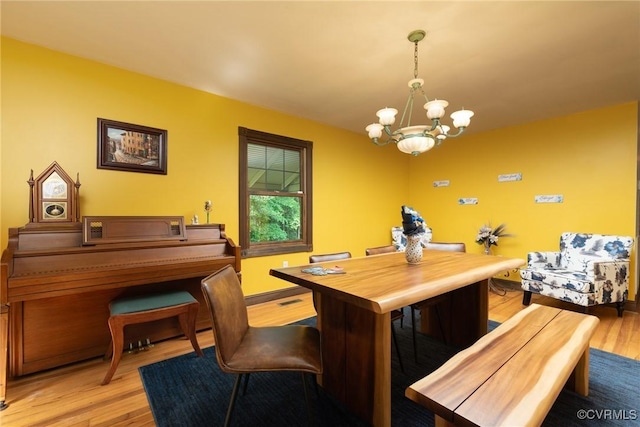 14421 Clazemont Rd, Montpelier, VA 23192 - dining area with a chandelier and wood finished floors
