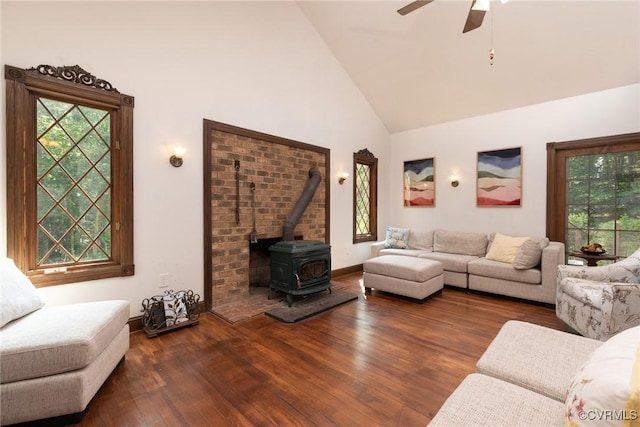 14421 Clazemont Rd, Montpelier, VA 23192 - living area with healthy amount of natural light, high vaulted ceiling, a wood stove, wood finished floors, and ceiling fan