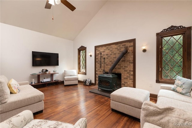14421 Clazemont Rd, Montpelier, VA 23192 - living room with high vaulted ceiling, ceiling fan, a wood stove, and wood finished floors