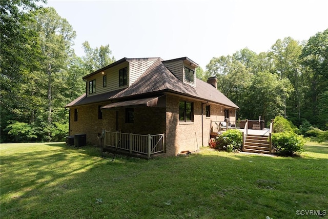 14421 Clazemont Rd, Montpelier, VA 23192 - back of property with a yard, a deck, brick siding, and a chimney