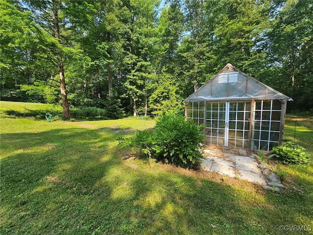 14421 Clazemont Rd, Montpelier, VA 23192 - view of grassy yard with an exterior structure, an outdoor structure, and a view of trees