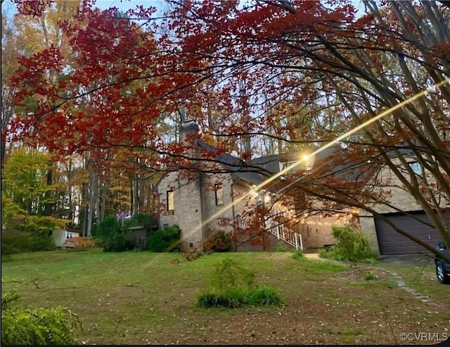 14421 Clazemont Rd, Montpelier, VA 23192 - view of side of home with a lawn and a garage