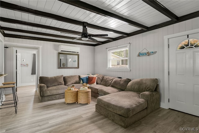 1659 Sunken Meadow Rd, Spring Grove, VA 23881 - living room with a wall mounted air conditioner, beamed ceiling, light wood-style flooring, wood walls, and a ceiling fan