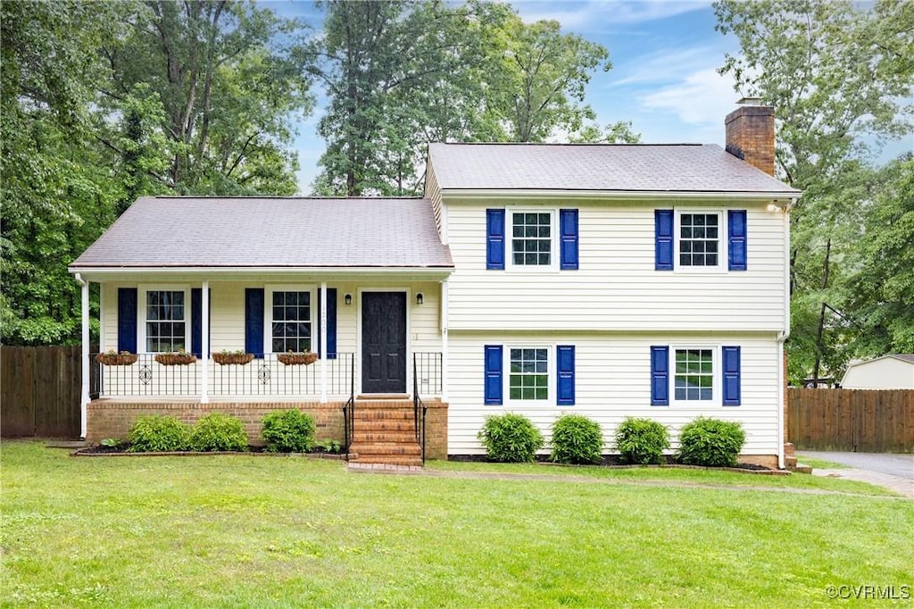 1700 Drifting Cir, Midlothian, VA 23113 - split level home featuring a chimney and a porch