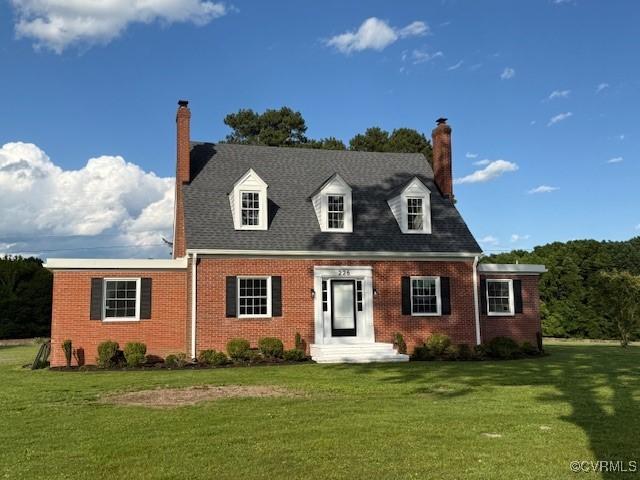 226 Purdy Rd, Emporia, VA 23847 - cape cod-style house featuring a chimney, brick siding, and a front yard