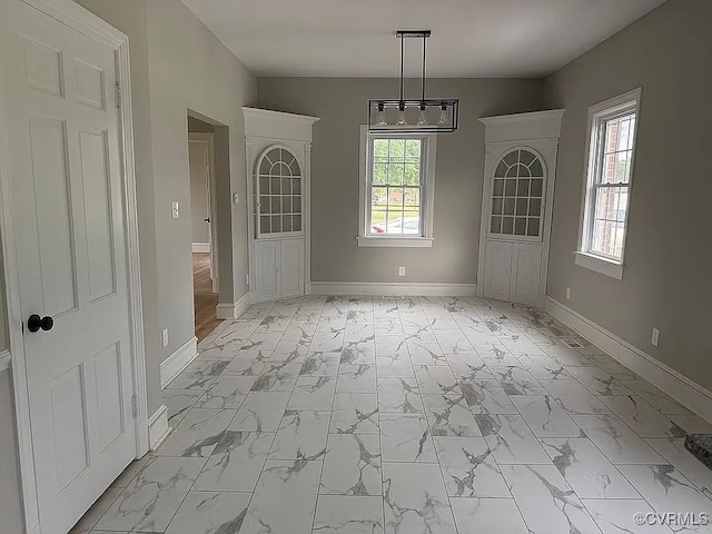 226 Purdy Rd, Emporia, VA 23847 - unfurnished dining area featuring light marble finish floors and plenty of natural light