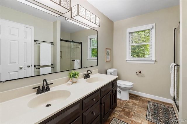 15210 Powell Grove Rd, Midlothian, VA 23112 - bathroom with healthy amount of natural light, a shower stall, double vanity, and stone finish floors