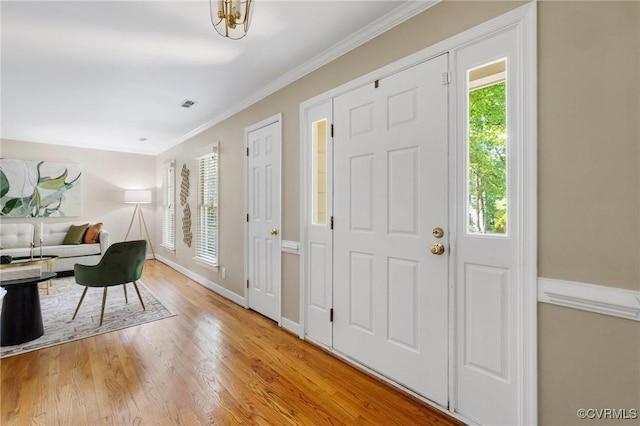 15210 Powell Grove Rd, Midlothian, VA 23112 - entryway with wood finished floors and ornamental molding