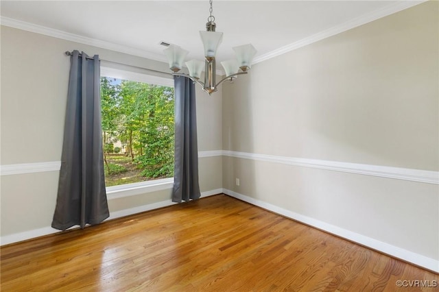 15210 Powell Grove Rd, Midlothian, VA 23112 - empty room featuring a chandelier, wood finished floors, and crown molding