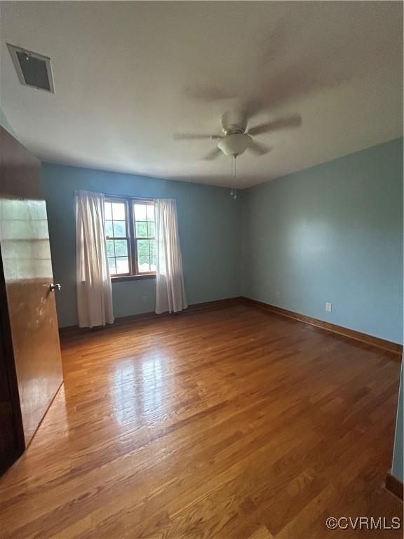 87 Northwood Ln, Cumberland, VA 23040 - spare room featuring ceiling fan, wood finished floors, and baseboards