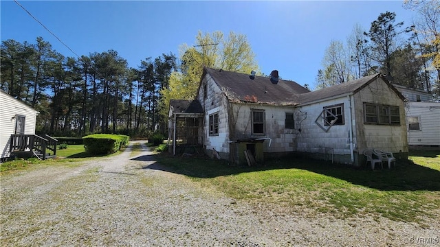 1989 Cox Rd, Nottoway, VA 23824 - view of side of property featuring a yard, a chimney, and concrete block siding
