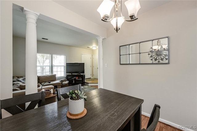 2906 Mary Beth Ln, Henrico, VA 23060 - dining area with decorative columns, a chandelier, wood finished floors, and baseboards