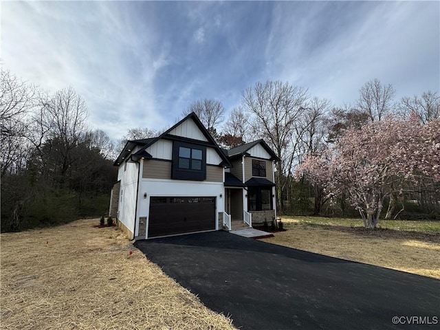 120 Drybridge Ct, Henrico, VA 23150 - view of front of house featuring an attached garage, asphalt driveway, and board and batten siding