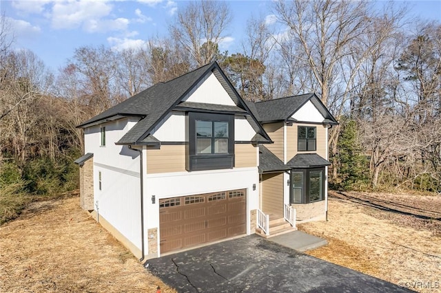120 Drybridge Ct, Henrico, VA 23150 - view of front of home featuring driveway, an attached garage, a shingled roof, and view of scattered trees