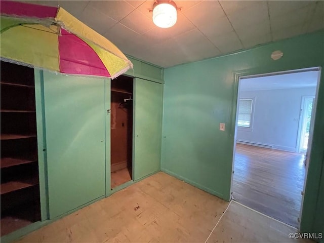 737 Jefferson Pl, Petersburg, VA 23803 - unfurnished bedroom with a baseboard heating unit and a closet