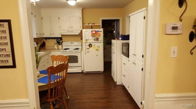 3917 London Rd, North Prince George, VA 23860 - kitchen featuring white appliances, under cabinet range hood, white cabinets, dark wood finished floors, and light countertops