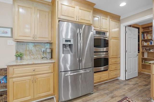 532 Fords Rd, Manakin Sabot, VA 23103 - kitchen featuring appliances with stainless steel finishes, light brown cabinets, crown molding, light wood-style floors, and backsplash