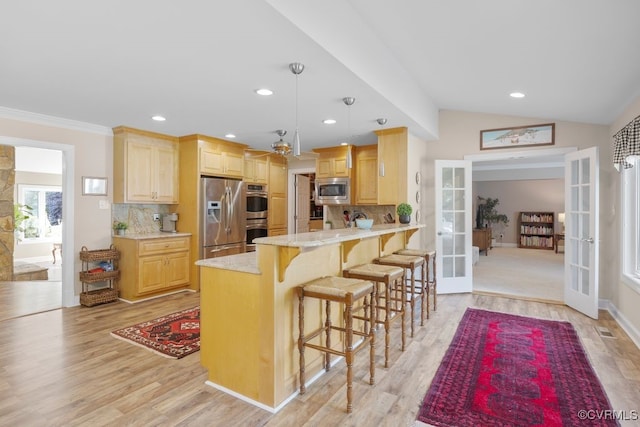 532 Fords Rd, Manakin Sabot, VA 23103 - kitchen featuring french doors, stainless steel appliances, light brown cabinetry, decorative backsplash, and recessed lighting