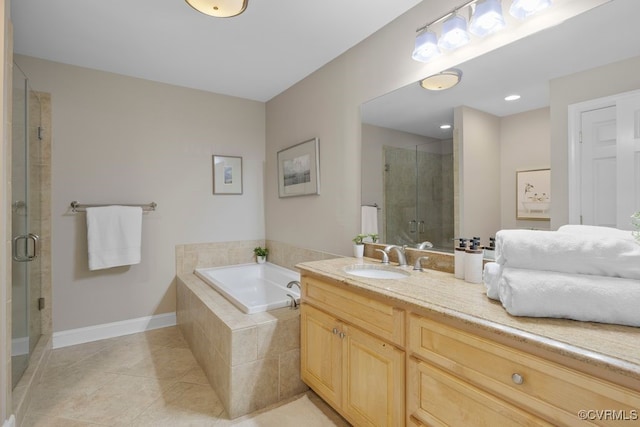 532 Fords Rd, Manakin Sabot, VA 23103 - bathroom featuring a shower stall, a garden tub, vanity, tile patterned floors, and baseboards