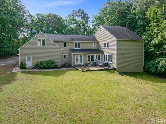 532 Fords Rd, Manakin Sabot, VA 23103 - back of house with french doors, a lawn, a wooden deck, view of wooded area, and cooling unit