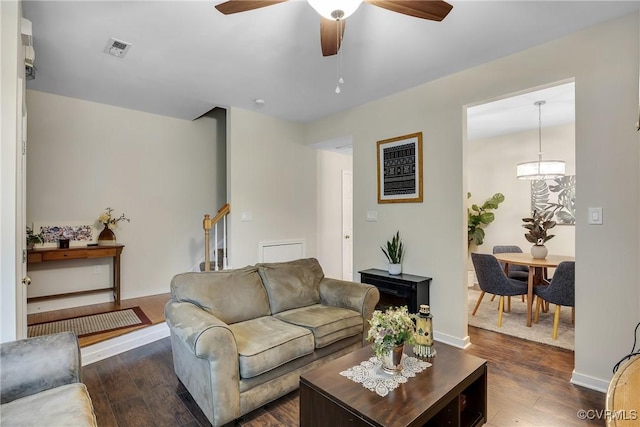 4613 Milfax Rd, Chesterfield, VA 23224 - living room with dark wood-style floors, a ceiling fan, and stairs