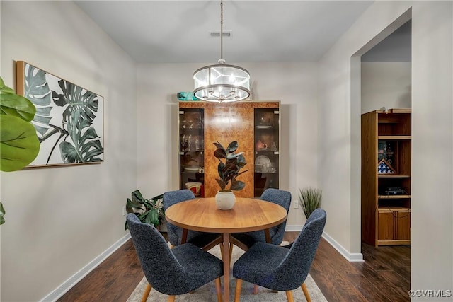 4613 Milfax Rd, Chesterfield, VA 23224 - dining area featuring a chandelier and dark wood finished floors