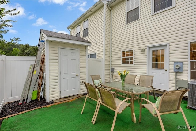 4613 Milfax Rd, Chesterfield, VA 23224 - fenced backyard featuring a storage unit and outdoor dining space