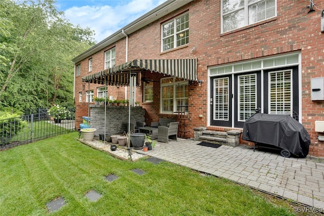11715 Triple Notch Ter, Henrico, VA 23233 - rear view of house with a patio area, brick siding, and outdoor lounge area