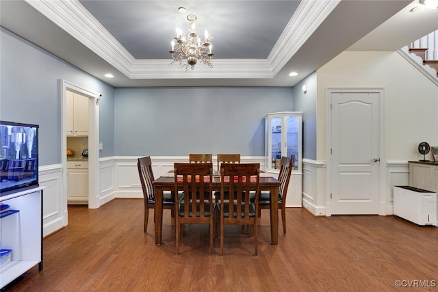 11715 Triple Notch Ter, Henrico, VA 23233 - dining space featuring ornamental molding, wood finished floors, a tray ceiling, a chandelier, and a wainscoted wall