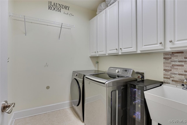 11715 Triple Notch Ter, Henrico, VA 23233 - washroom with washing machine and clothes dryer, cabinet space, baseboards, and light tile patterned floors