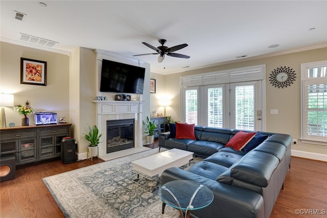 11715 Triple Notch Ter, Henrico, VA 23233 - living room featuring ceiling fan, wood finished floors, crown molding, baseboards, and a fireplace
