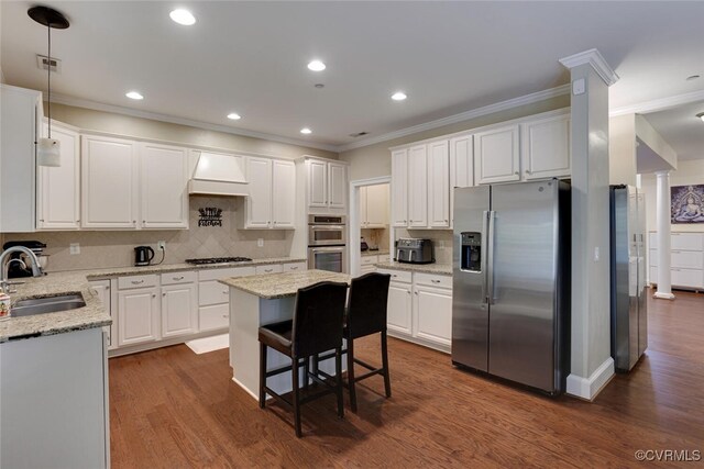 11715 Triple Notch Ter, Henrico, VA 23233 - kitchen with appliances with stainless steel finishes, a sink, ornamental molding, white cabinetry, and recessed lighting