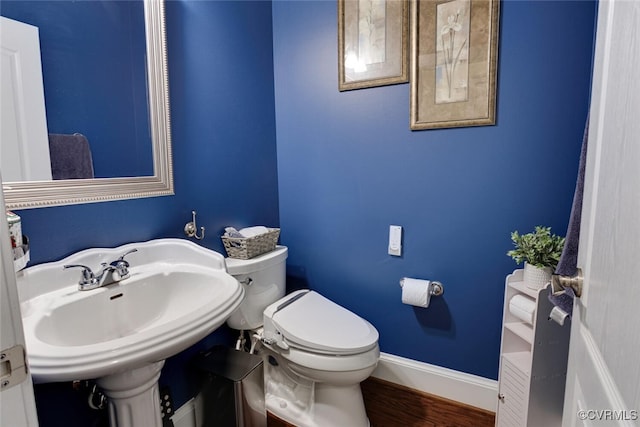 11715 Triple Notch Ter, Henrico, VA 23233 - half bathroom with toilet, wood finished floors, baseboards, and a sink