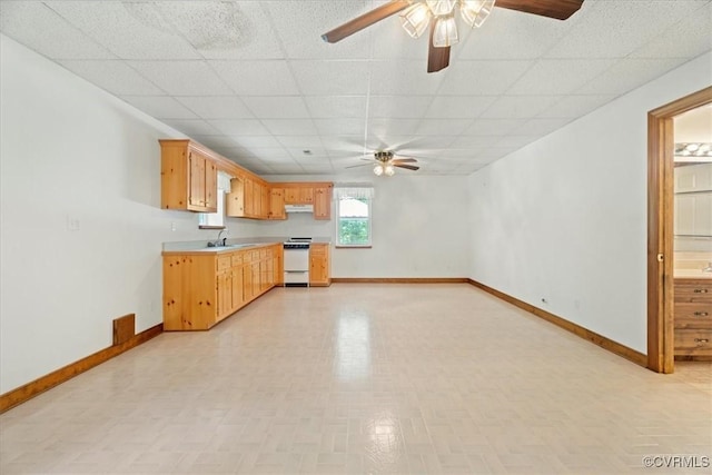 3786 Donavon Mill Ct, Powhatan, VA 23139 - kitchen featuring white range oven, a ceiling fan, a paneled ceiling, light countertops, and baseboards