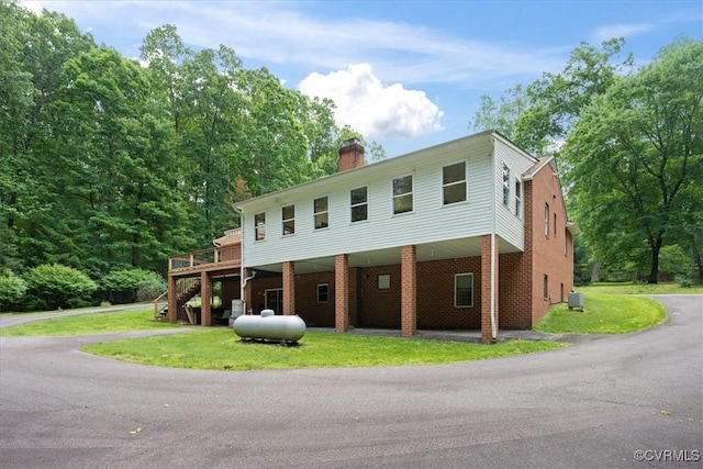 3786 Donavon Mill Ct, Powhatan, VA 23139 - view of front of property featuring stairs, a chimney, a front lawn, asphalt driveway, and a deck