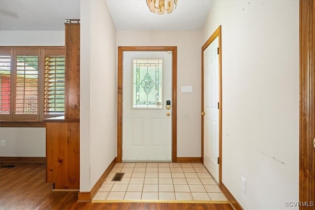 3786 Donavon Mill Ct, Powhatan, VA 23139 - foyer featuring plenty of natural light, a chandelier, baseboards, and light wood-style flooring