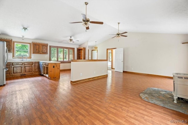 3786 Donavon Mill Ct, Powhatan, VA 23139 - unfurnished living room featuring wood finished floors, a sink, lofted ceiling, baseboards, and ceiling fan