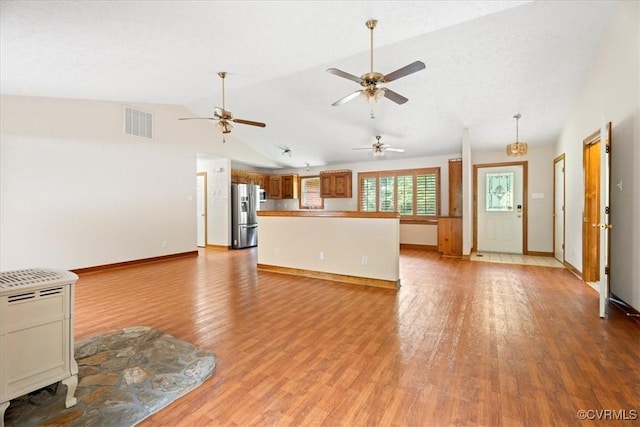 3786 Donavon Mill Ct, Powhatan, VA 23139 - unfurnished living room with light wood-style floors, vaulted ceiling, baseboards, and ceiling fan