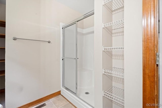 3786 Donavon Mill Ct, Powhatan, VA 23139 - full bathroom with a stall shower, baseboards, and tile patterned flooring