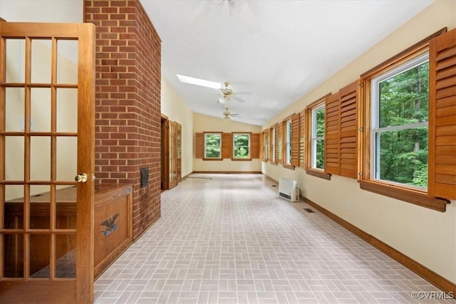 3786 Donavon Mill Ct, Powhatan, VA 23139 - hallway featuring brick patterned floors, lofted ceiling, baseboards, healthy amount of natural light, and a skylight
