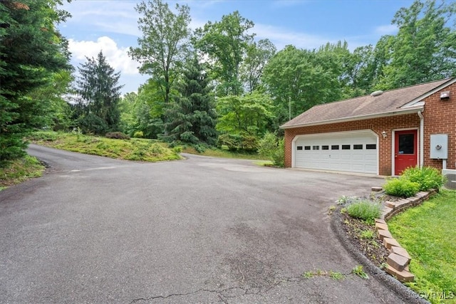 3786 Donavon Mill Ct, Powhatan, VA 23139 - view of property exterior with brick siding, asphalt driveway, and an attached garage