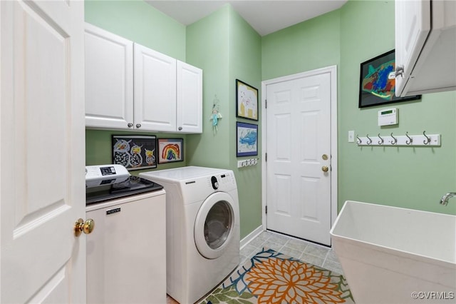 11601 Shadow Run Ln, Glen Allen, VA 23059 - laundry area with cabinet space, separate washer and dryer, light tile patterned floors, and baseboards