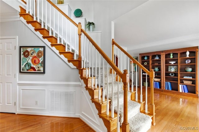 11601 Shadow Run Ln, Glen Allen, VA 23059 - staircase featuring wood finished floors, crown molding, and a decorative wall