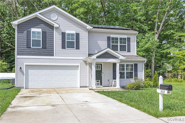 3612 Roselawn Ter, Hopewell, VA 23860 - traditional-style house with driveway, an attached garage, solar panels, and view of wooded area