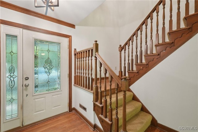 5910 Harbourwood Pl, Chesterfield, VA 23112 - foyer entrance featuring light wood-style floors, stairway, baseboards, and vaulted ceiling