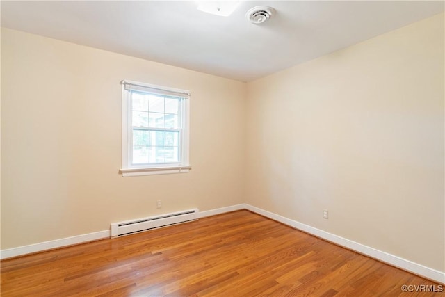 5441 Claridge Dr, Chesterfield, VA 23832 - empty room featuring baseboard heating, wood finished floors, and baseboards