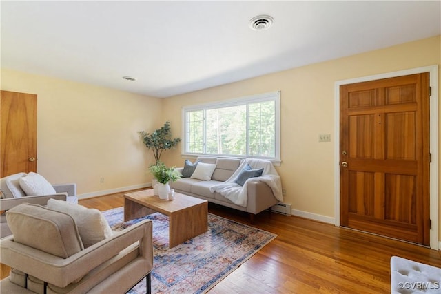 5441 Claridge Dr, Chesterfield, VA 23832 - living area featuring baseboards, a baseboard radiator, and light wood-type flooring