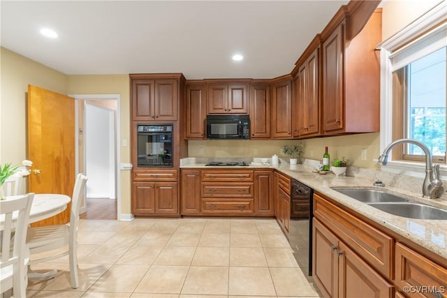 5441 Claridge Dr, Chesterfield, VA 23832 - kitchen with black appliances, a sink, light stone countertops, recessed lighting, and light tile patterned flooring