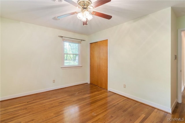 5441 Claridge Dr, Chesterfield, VA 23832 - unfurnished bedroom with baseboards, wood finished floors, a closet, and a ceiling fan
