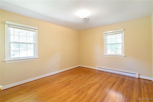5441 Claridge Dr, Chesterfield, VA 23832 - unfurnished room featuring a baseboard radiator, light wood-style floors, and baseboards